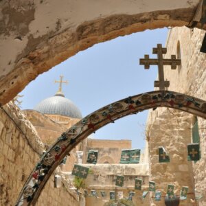 Why is there graffiti in the Church of the Holy Sepulchre?